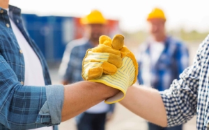 Two workers shaking hands