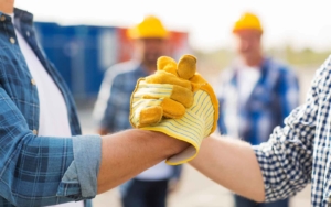 Two workers shaking hands