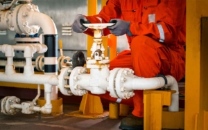 man working on large pipes